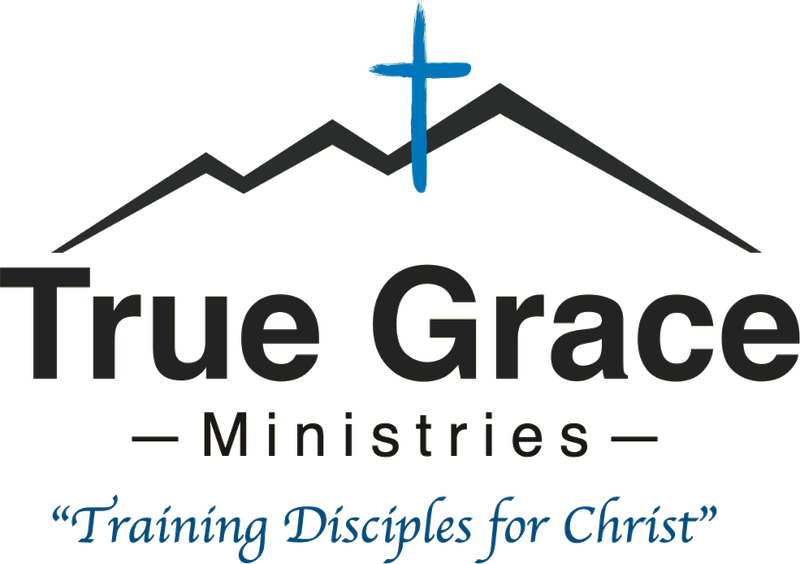 True Grace Ministries logo: a cross rising over a mountain ridge, with the words Training Disciples for Christ